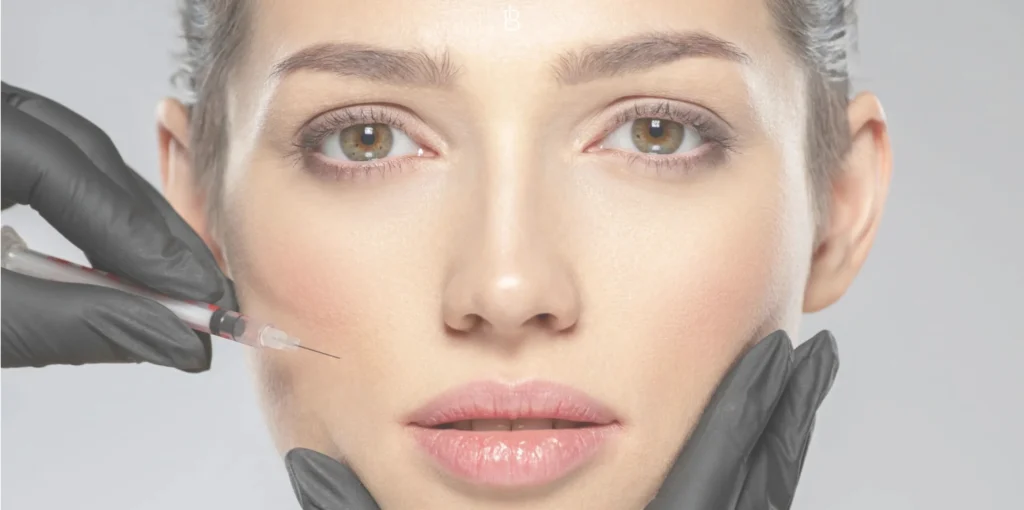 Woman getting BOTOX injections to her cheeks