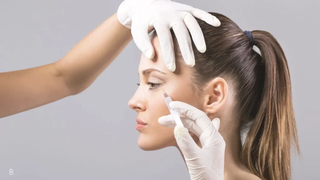 Woman getting BOTOX injections on her brow area